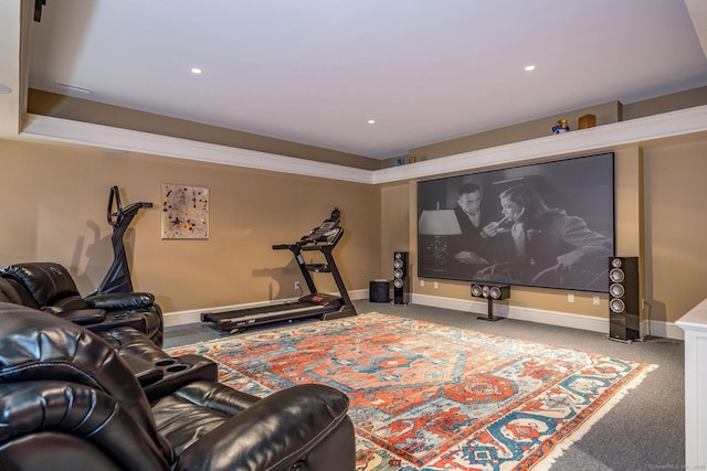 carpeted cinema with baseboards and recessed lighting