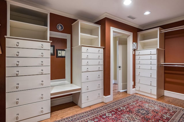 spacious closet featuring light wood-type flooring and visible vents