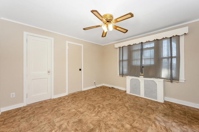 unfurnished room with baseboards, crown molding, and radiator heating unit