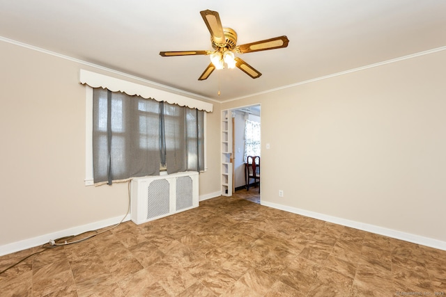 spare room featuring radiator, baseboards, ornamental molding, and a ceiling fan