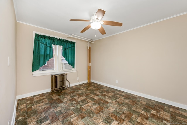 unfurnished room with crown molding, stone finish flooring, radiator heating unit, and baseboards