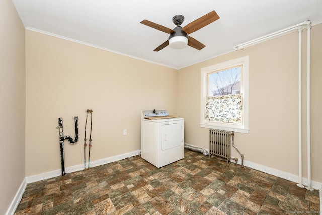 laundry area with baseboards, laundry area, washer / clothes dryer, and radiator