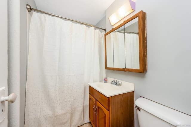 full bathroom featuring vanity and toilet