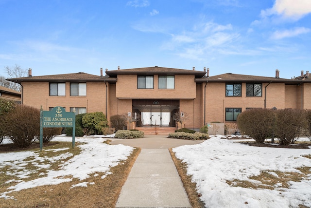 view of front facade featuring brick siding