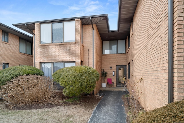 entrance to property with brick siding