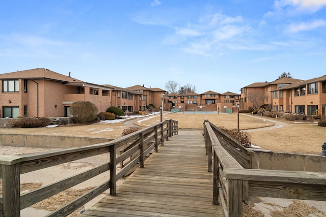 exterior space featuring fence and a residential view