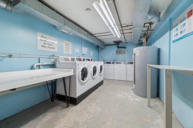 common laundry area with water heater and separate washer and dryer