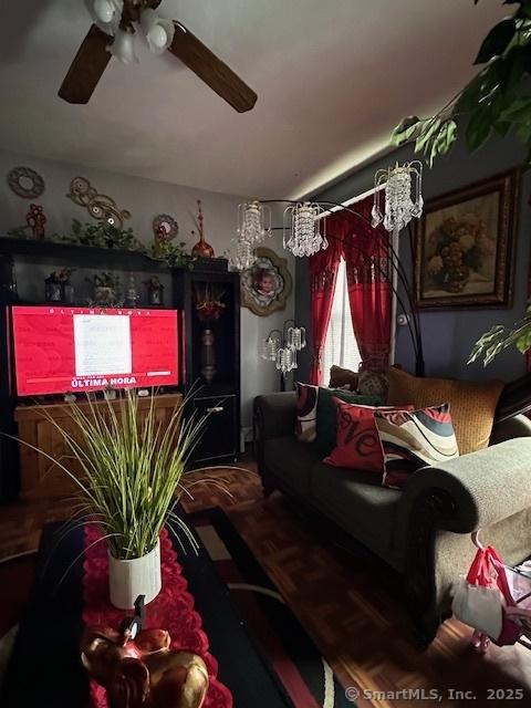 living area featuring ceiling fan