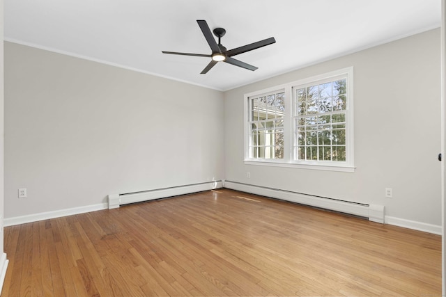 unfurnished room featuring light wood-type flooring, crown molding, and baseboards