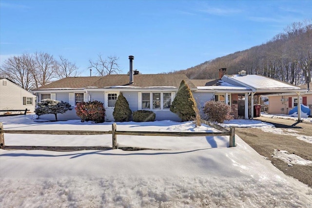 ranch-style house with a mountain view