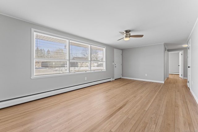 unfurnished room featuring a ceiling fan, light wood-type flooring, baseboards, and baseboard heating