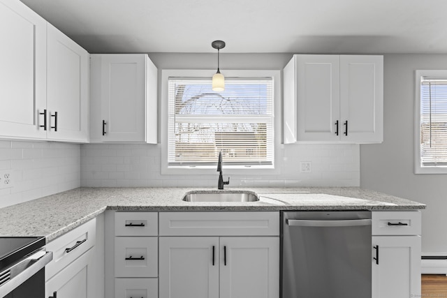 kitchen with light stone countertops, stainless steel dishwasher, white cabinetry, pendant lighting, and a sink