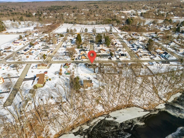 snowy aerial view with a residential view