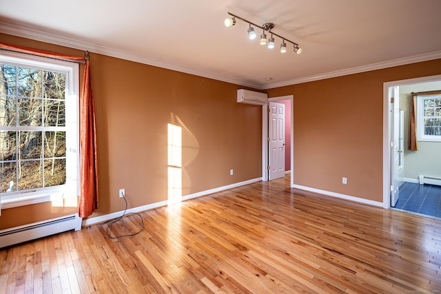 unfurnished room featuring light wood-style floors, a baseboard radiator, crown molding, and a wall mounted AC