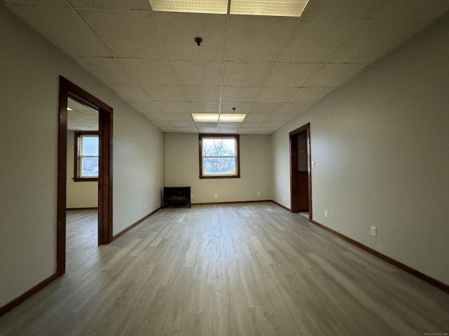 empty room featuring light wood-style flooring and baseboards