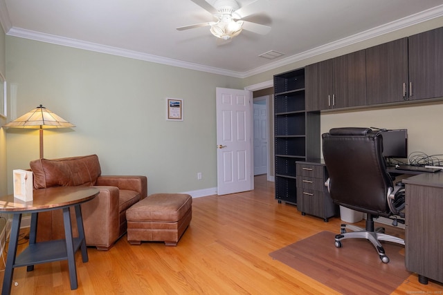 office featuring ceiling fan, ornamental molding, light wood-style flooring, and baseboards