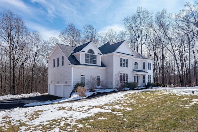 view of front facade featuring driveway and an attached garage