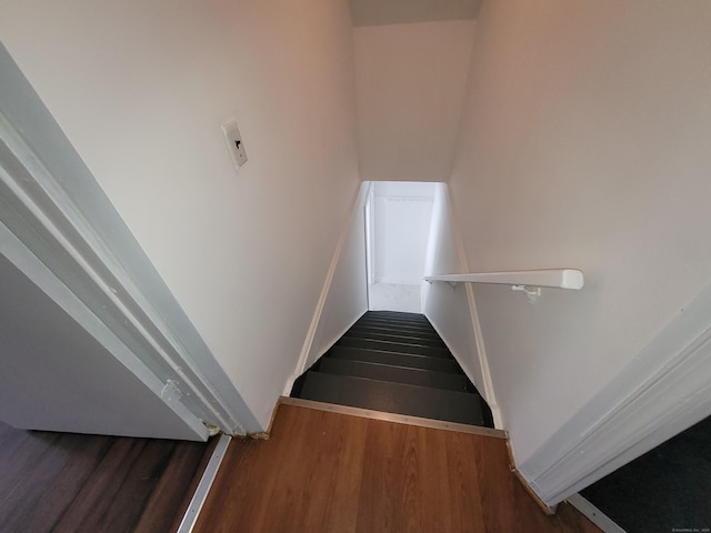 stairway with wood finished floors