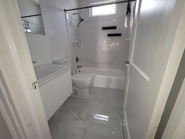 bathroom featuring toilet, marble finish floor, shower / washtub combination, and vanity