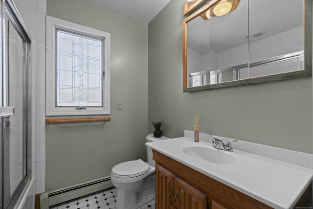 full bathroom featuring enclosed tub / shower combo, toilet, vanity, baseboard heating, and tile patterned floors