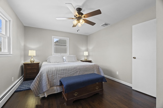 bedroom with baseboards, visible vents, a ceiling fan, a baseboard radiator, and dark wood-type flooring