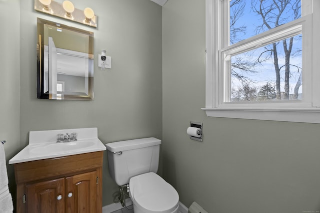 bathroom with toilet and vanity