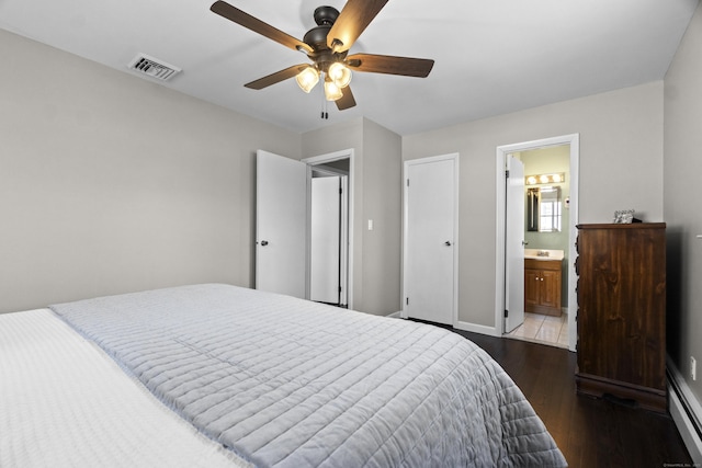 bedroom featuring baseboards, visible vents, a ceiling fan, dark wood-style floors, and ensuite bathroom