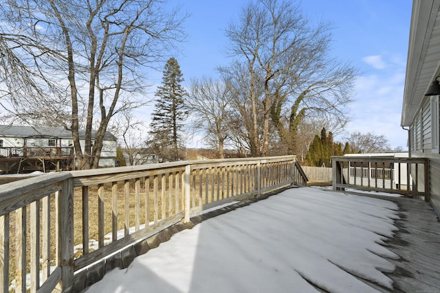 view of snow covered deck