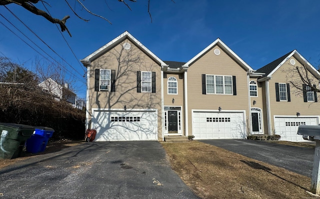 traditional-style house featuring driveway and a garage