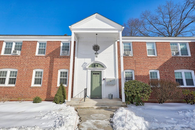 view of front of home featuring brick siding