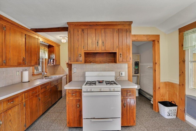 kitchen featuring white appliances, light countertops, vaulted ceiling, tasteful backsplash, and baseboard heating