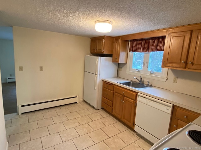 kitchen featuring light countertops, a baseboard heating unit, brown cabinetry, a sink, and white appliances