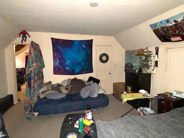 interior space featuring lofted ceiling and carpet
