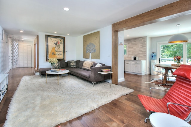 living area featuring dark wood-style floors and recessed lighting