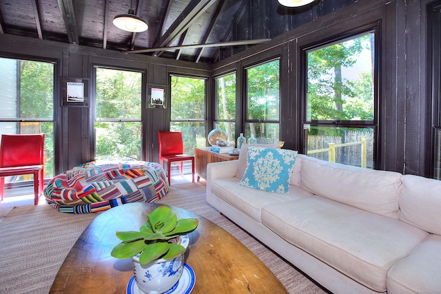 sunroom / solarium featuring a wealth of natural light, wooden ceiling, and beam ceiling