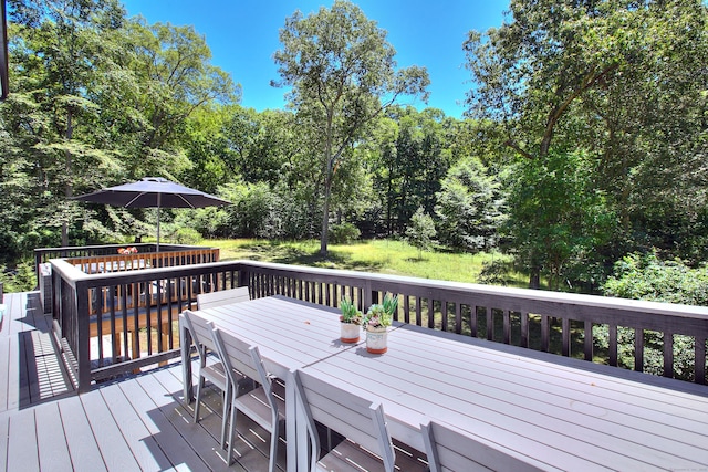 deck featuring outdoor dining area