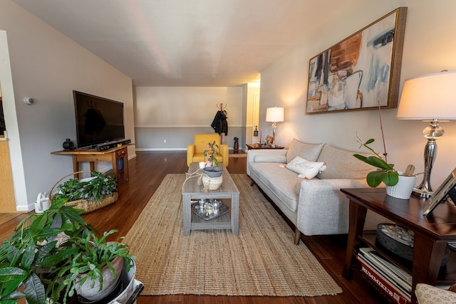 living area featuring wood finished floors and baseboards