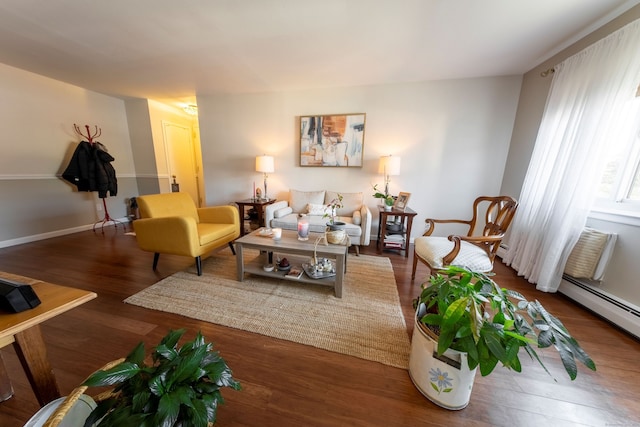 living room with a baseboard radiator and wood finished floors