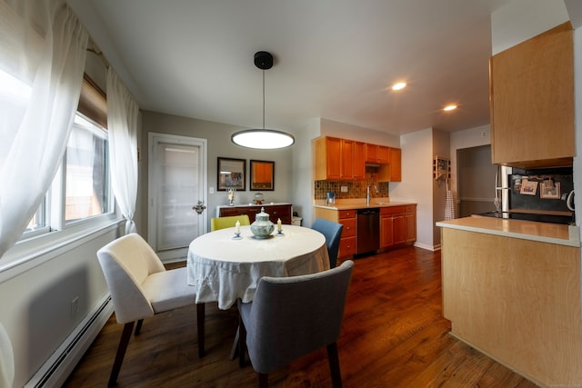 dining area with a baseboard radiator, dark wood-type flooring, and recessed lighting