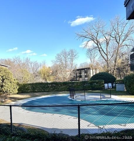 view of sport court with fence