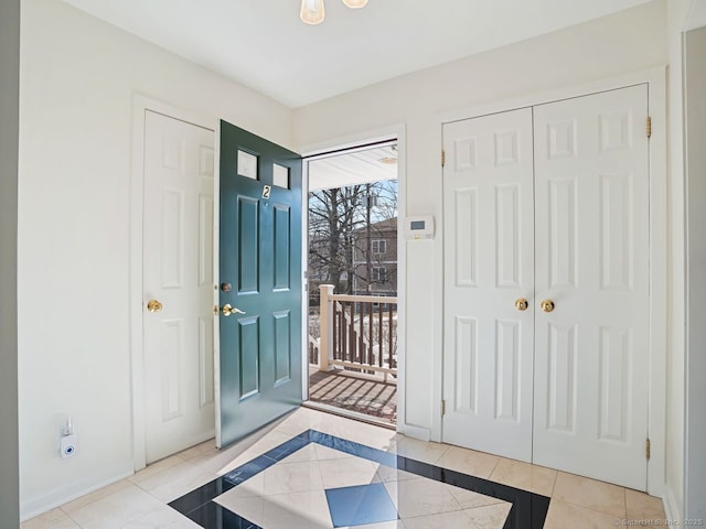 foyer featuring light tile patterned flooring