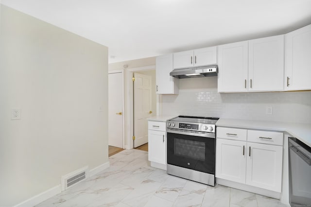 kitchen featuring stainless steel appliances, light countertops, visible vents, and under cabinet range hood