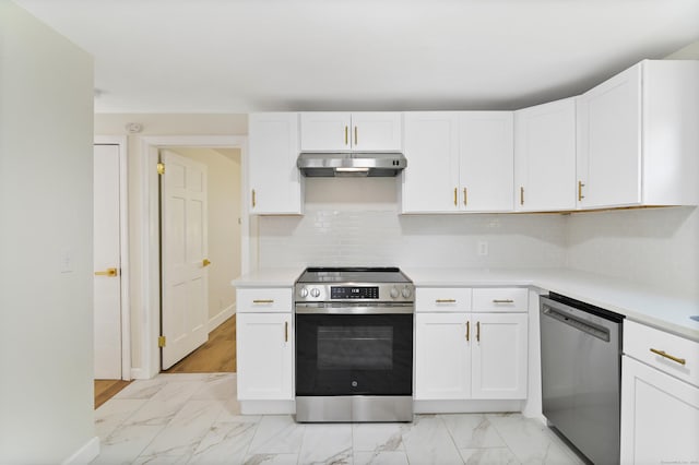 kitchen with under cabinet range hood, white cabinetry, stainless steel appliances, and light countertops