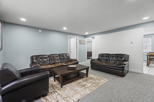 living area featuring recessed lighting, light carpet, and baseboards