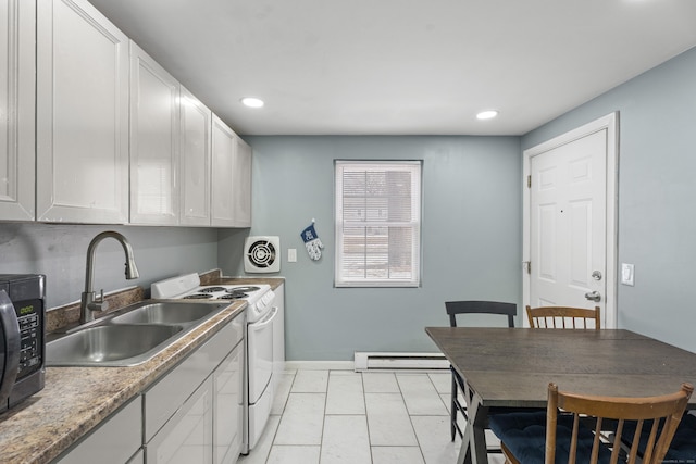 kitchen featuring electric range, baseboard heating, a sink, and white cabinetry