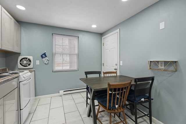 dining room featuring recessed lighting, baseboards, visible vents, and baseboard heating