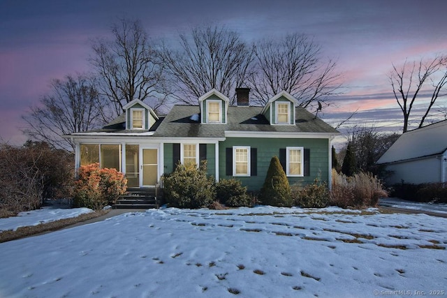 cape cod home with a chimney