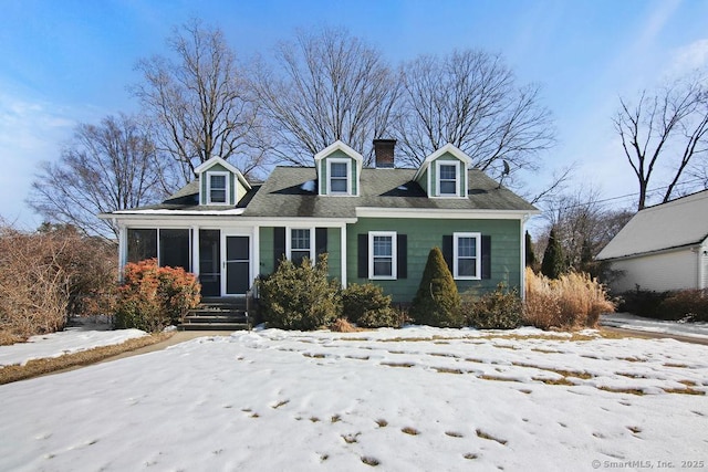 cape cod house with a chimney