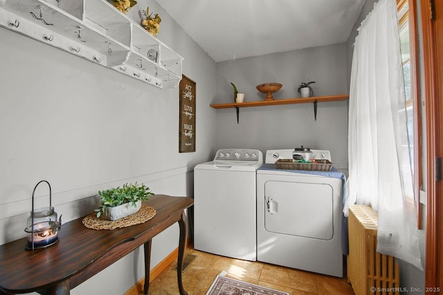 laundry room with laundry area, light tile patterned flooring, visible vents, and separate washer and dryer