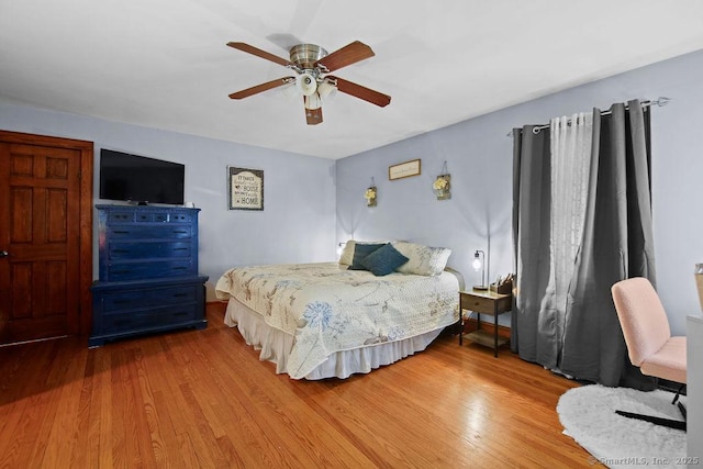 bedroom with ceiling fan and wood finished floors